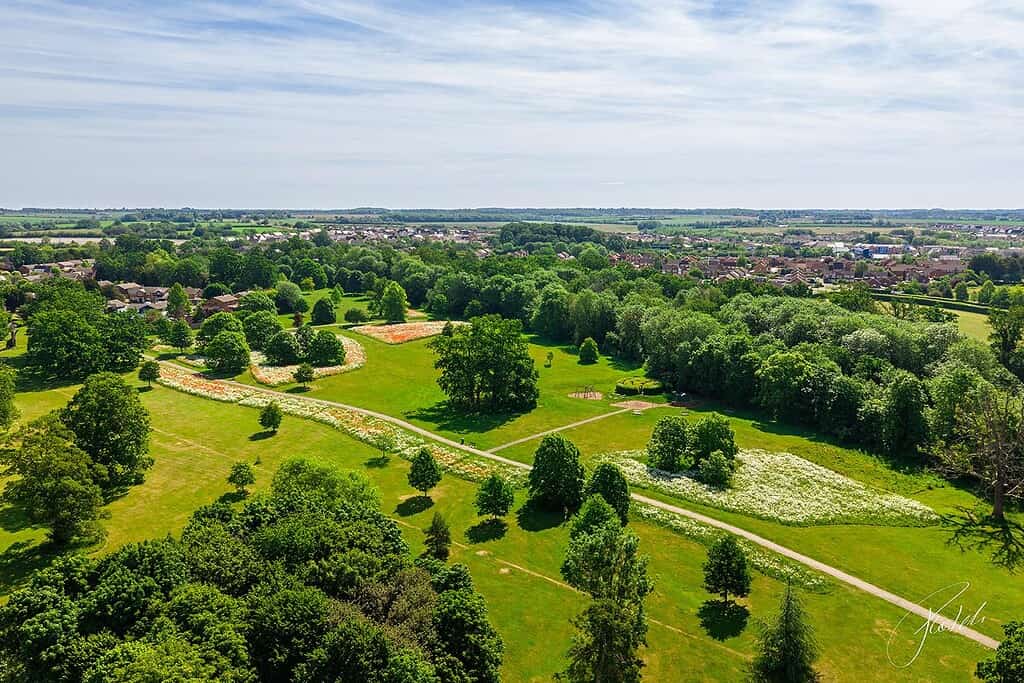 Wide drone view of green space network and ecological corridors in Huntingdonshire Priory Park