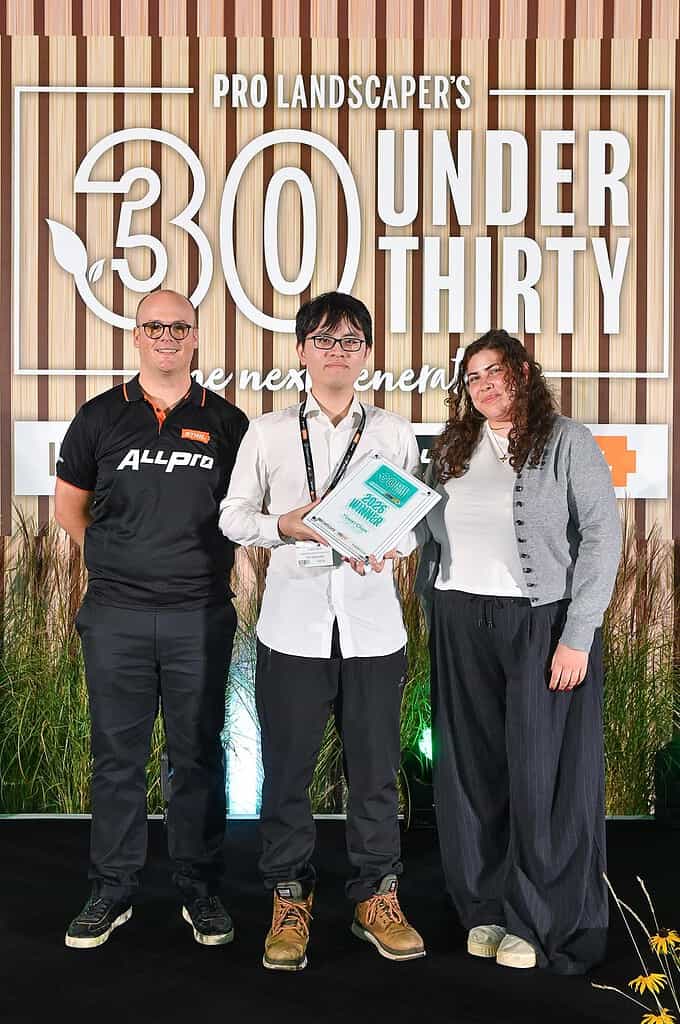 Yuwei Chen receiving Pro Landscaper 30 Under 30 award on stage at FutureScape with epd Landscape